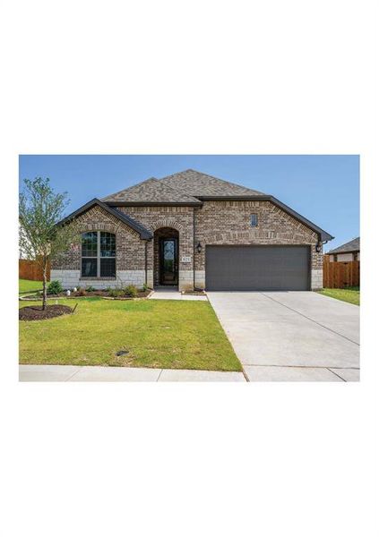 View of front facade featuring a front lawn and a garage