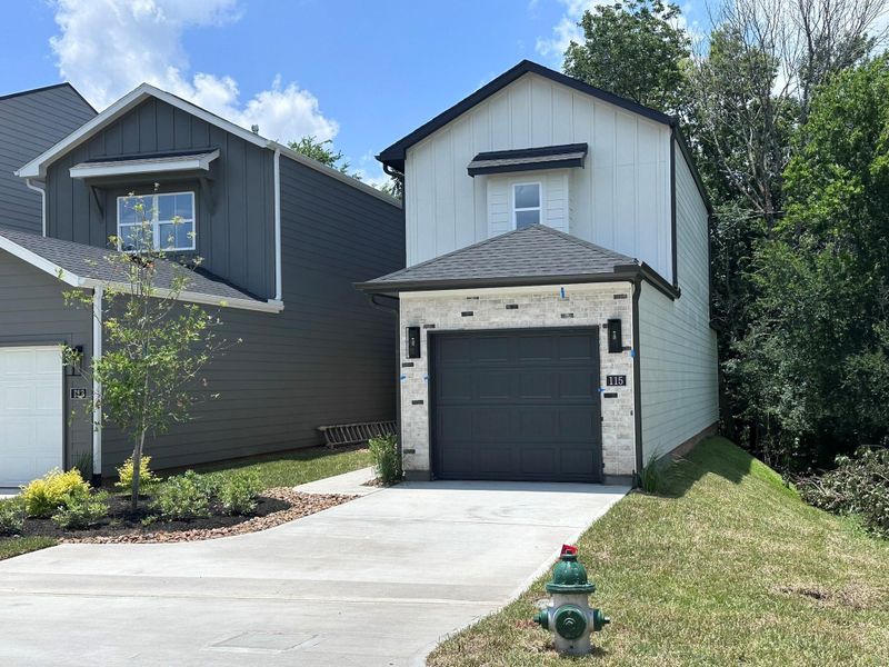 Front exterior of a new home in , Montgomery, TX, highlighting curb appeal (Image 3).