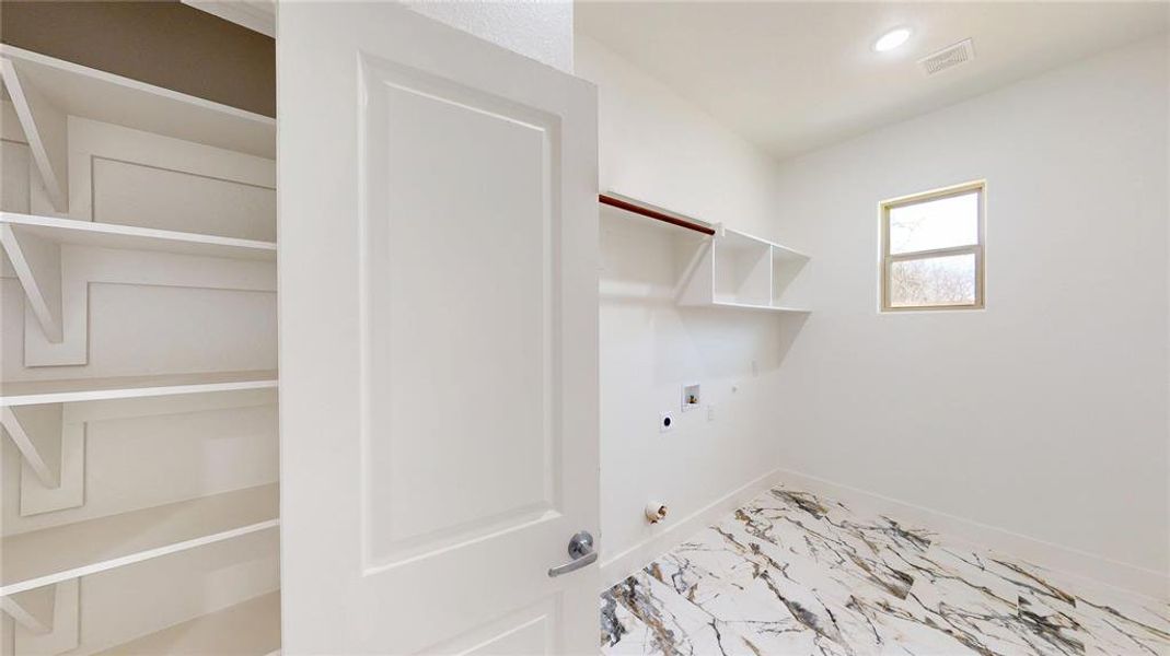 Laundry area with marble finish floor, visible vents, gas dryer hookup, electric dryer hookup, and laundry area