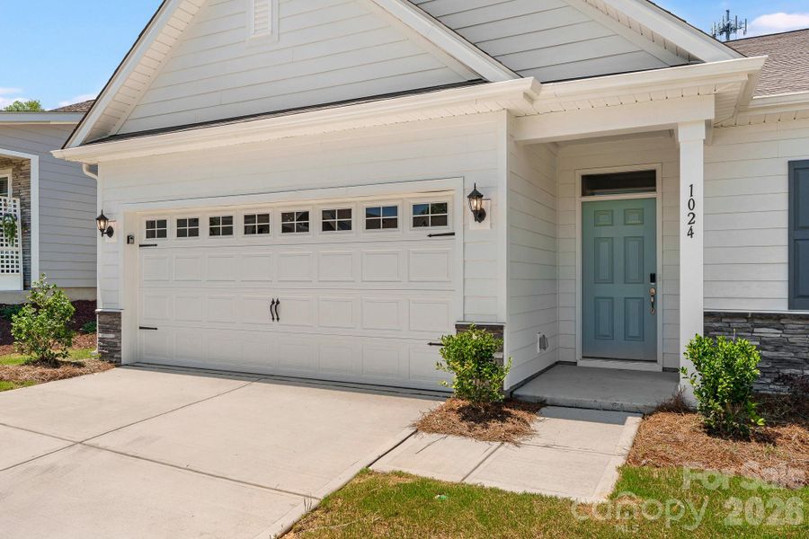 Exterior details and patio area of a home in Cottages at Indian Trail West, Indian Trail (Image 3).