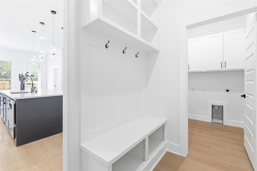 Mudroom featuring light wood-style flooring