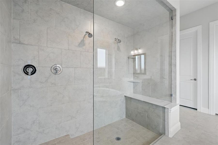 Bathroom featuring a walk in shower and tile patterned floors