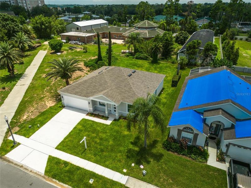 Front exterior of a new home in , Kissimmee, FL, highlighting curb appeal (Image 38).