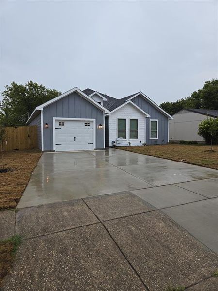 Ranch-style home with a garage