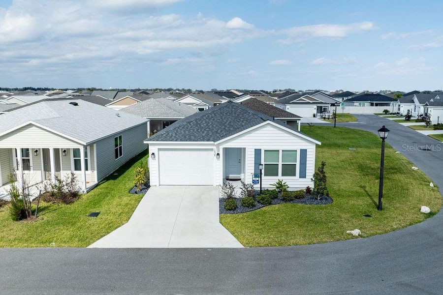 Front exterior of a new home in , The Villages, FL, highlighting curb appeal (Image 29).