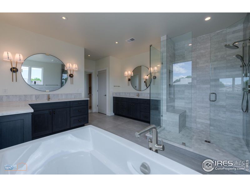 Primary Bath Features A Bain Ultra Air Jetted Tub, Large Marble & Tile Shower, Heated Floor, Double Vanities, Private Commode And Linen Closet