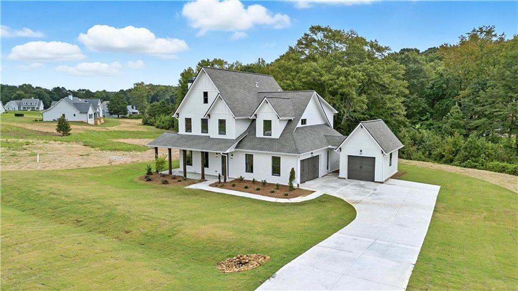 Front exterior of a new home in Old Town Estates, Dacula, GA, highlighting curb appeal (Image 30).