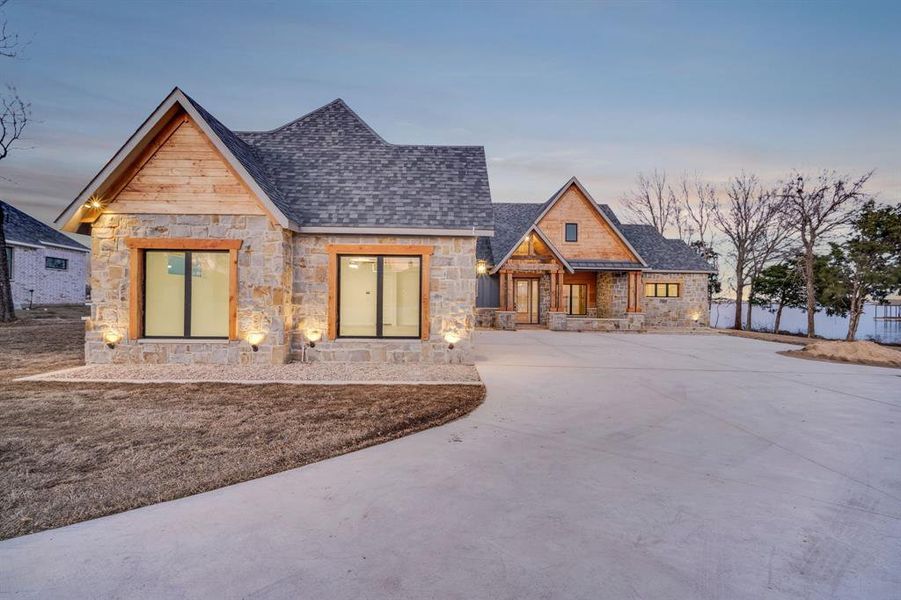 Front exterior of a new home in , Ennis, TX, highlighting curb appeal (Image 21).