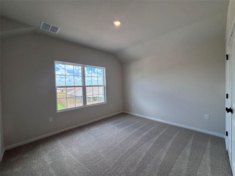 Spacious, unfurnished interior of a new home in The Colony, Bastrop (Image 24).