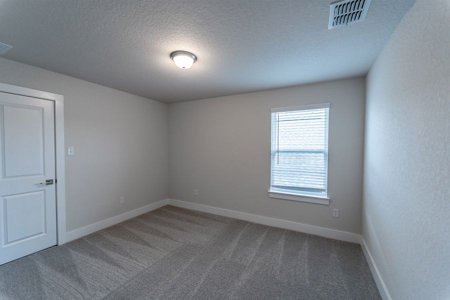 Spacious, unfurnished interior of a new home in The Woodlands at Medina Hills, Mico (Image 18).