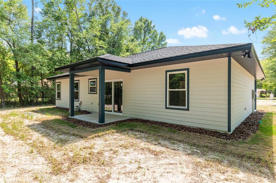 Exterior details and patio area of a home in , Fort White (Image 37).