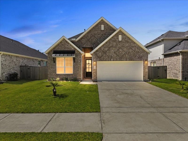 Front exterior of a new home in Mulberry Farms, Santa Fe, TX, highlighting curb appeal (Image 1). Front exterior of a new home in Mulberry Farms, Santa Fe, TX, highlighting curb appeal (Image 1).