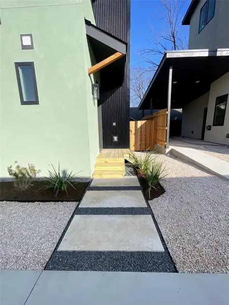 Entrance to property featuring stucco siding