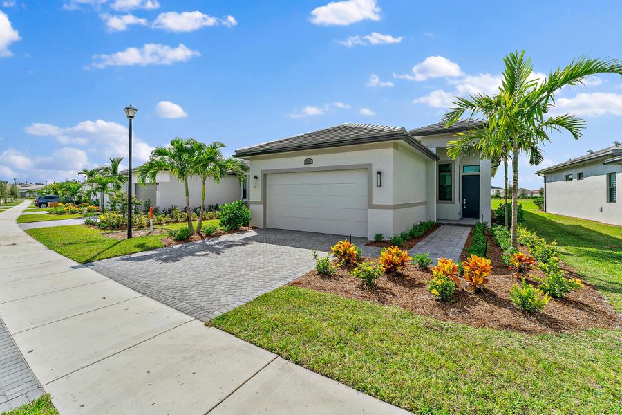 Front exterior of a new home in , Port St. Lucie, FL, highlighting curb appeal (Image 1). Front exterior of a new home in , Port St. Lucie, FL, highlighting curb appeal (Image 1).