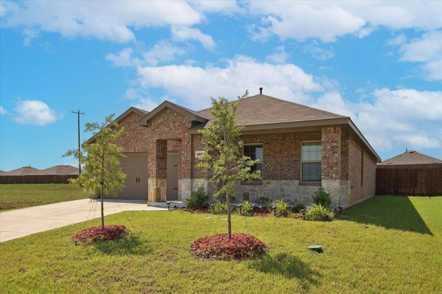 Front exterior of a new home in Riverfield, Josephine, TX, highlighting curb appeal (Image 1). Front exterior of a new home in Riverfield, Josephine, TX, highlighting curb appeal (Image 1).