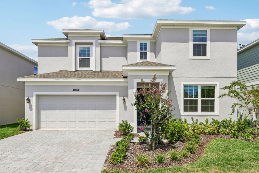 Front exterior of a new home in Harrell Oaks, Orlando, FL, highlighting curb appeal (Image 1). Front exterior of a new home in Harrell Oaks, Orlando, FL, highlighting curb appeal (Image 1).