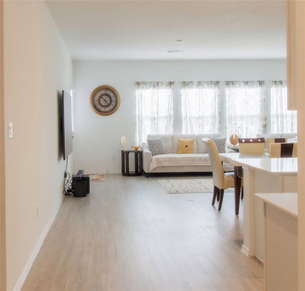 Spacious perspective from the entry highlighting the seamless flow of the home’s living spaces.