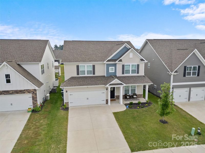Front exterior of a new home in , Hendersonville, NC, highlighting curb appeal (Image 23).
