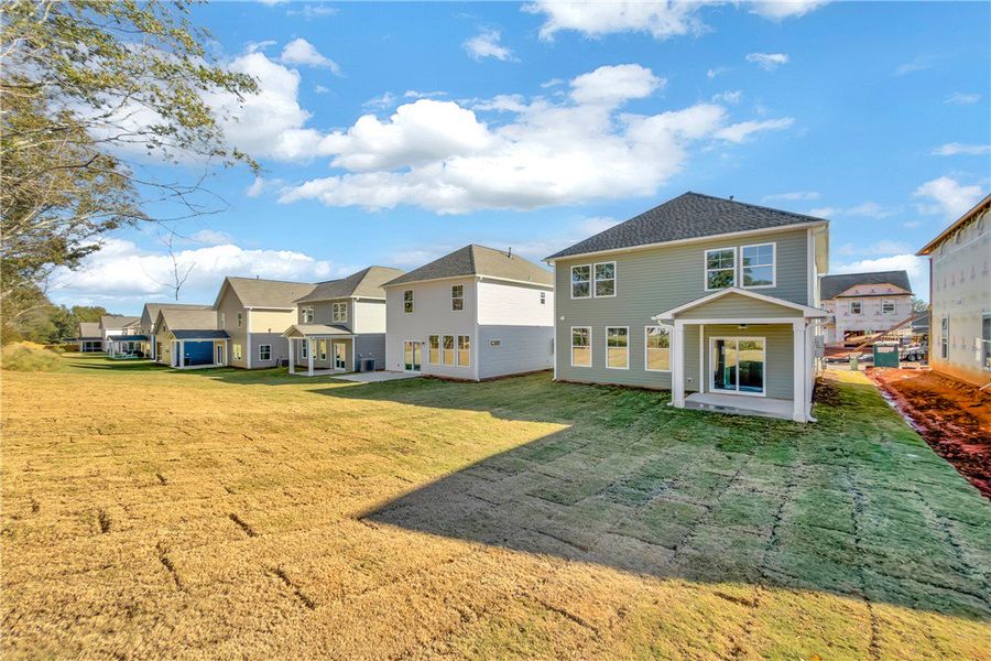 Exterior details and patio area of a home in Brownstone Park, Easley (Image 14).