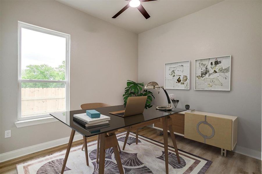 Office area featuring baseboards, a ceiling fan, and wood finished floors Office area featuring baseboards, a ceiling fan, and wood finished floors