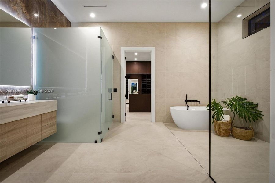 Bathroom with glass panel shower