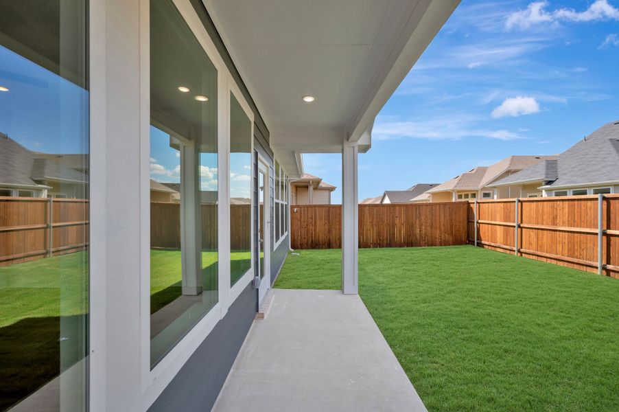 Exterior details and patio area of a home in The Meadows, Denton (Image 18).