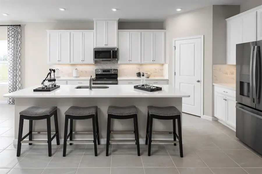 Representative furnished interior of a home built from the Sandalwood by Ryan Homes in Bellaviva, Auburndale (Image 8).