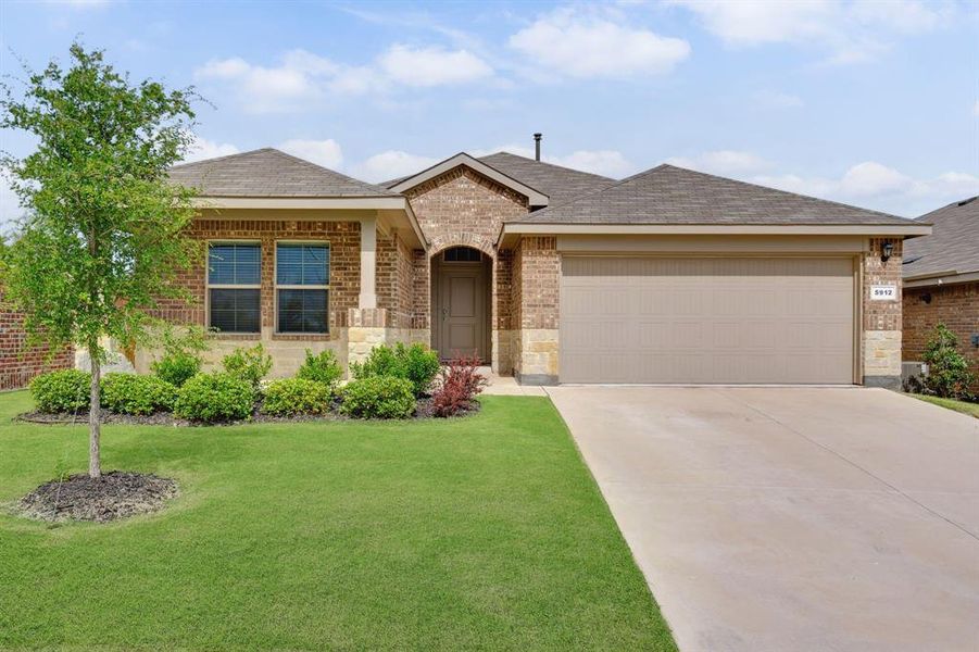 Front exterior of a new home in Cambridge Brook, Denton, TX, highlighting curb appeal (Image 1). Front exterior of a new home in Cambridge Brook, Denton, TX, highlighting curb appeal (Image 1).