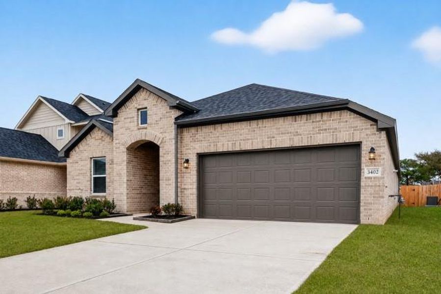 Front exterior of a new home in Rollingbrook Estates, Baytown, TX, highlighting curb appeal (Image 2). Front exterior of a new home in Rollingbrook Estates, Baytown, TX, highlighting curb appeal (Image 2).