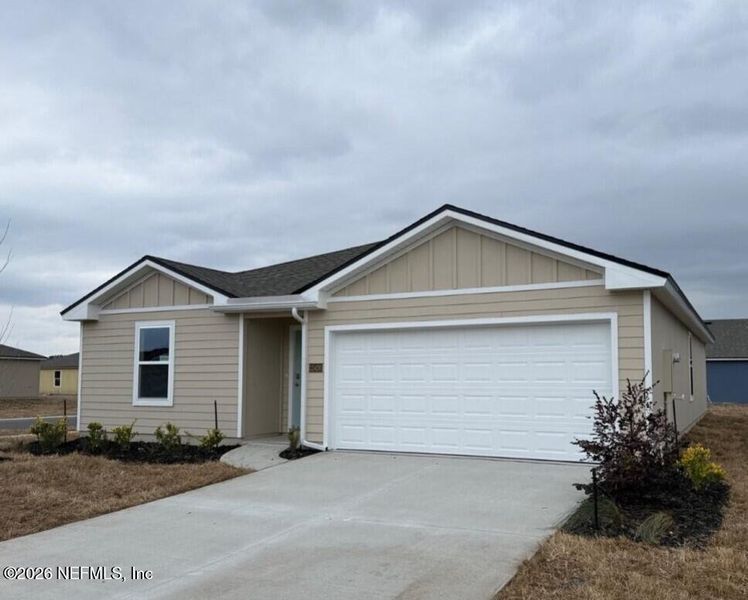 Front exterior of a new home in The Arbors, Jacksonville, FL, highlighting curb appeal (Image 7).