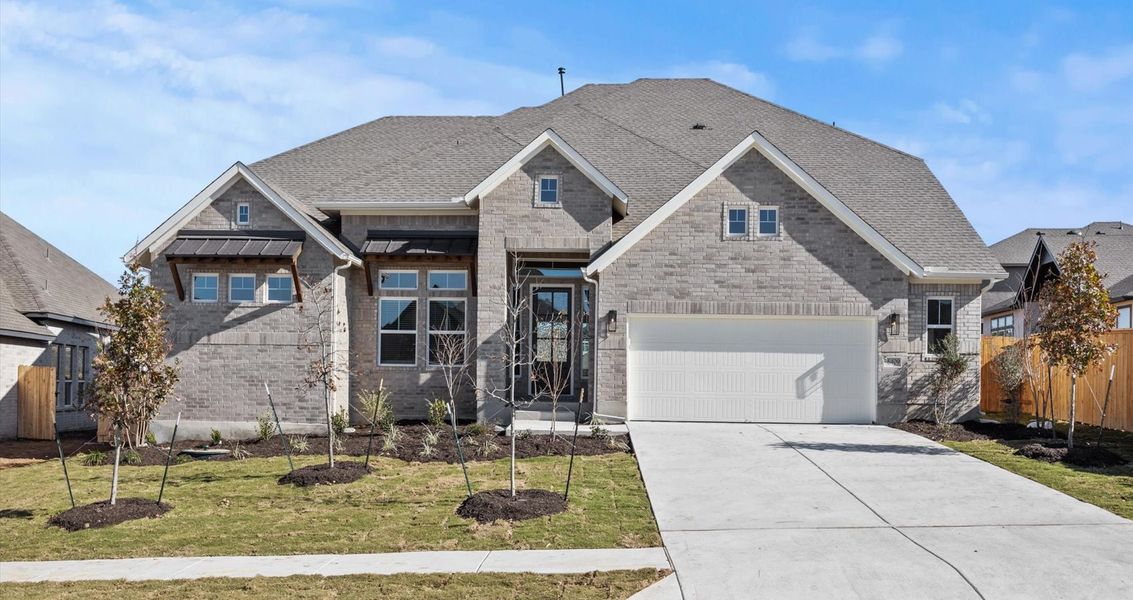 Representative exterior photo of a completed home built from the Raegan by Chesmar Homes in Sweetwater, Austin, TX (Image 1).
