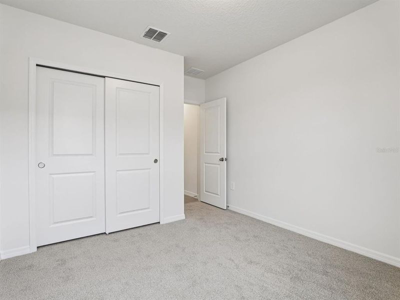 Spacious, unfurnished interior of a new home in The Grove at Stuart Crossing - Classic Series, Bartow (Image 11).
