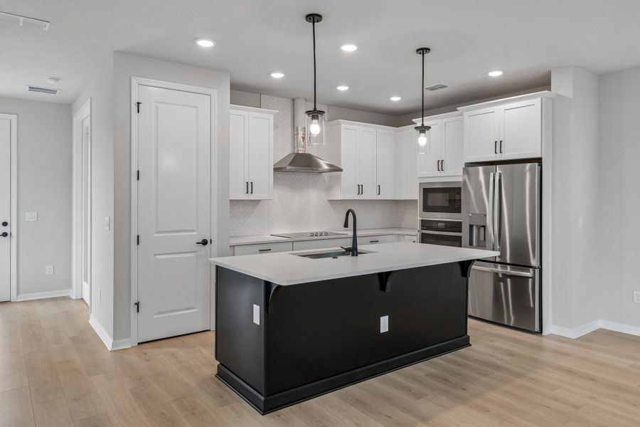Furnished interior view inside a new home in Weslyn Park in Sunbridge 34', St. Cloud (Image 7).