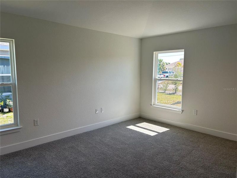 Spacious, unfurnished interior of a new home in Watercress Cove, North Port (Image 14).