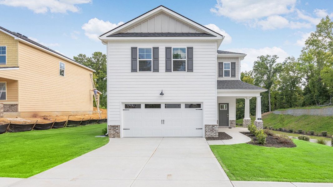 Front exterior of a new home in Southwind Village, Evans, GA, highlighting curb appeal (Image 1). Front exterior of a new home in Southwind Village, Evans, GA, highlighting curb appeal (Image 1).