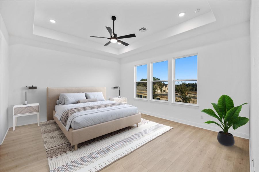 *Virtually Staged Primary Bedroom featuring light wood-style flooring, a ceiling fan, and recessed lighting