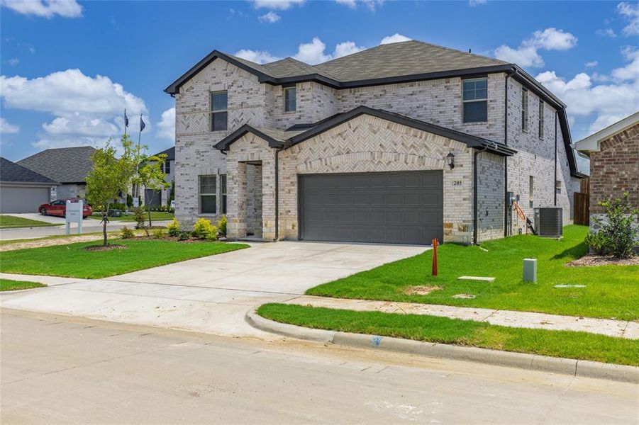 Front exterior of a new home in Stratton Place, Greenville, TX, highlighting curb appeal (Image 16).