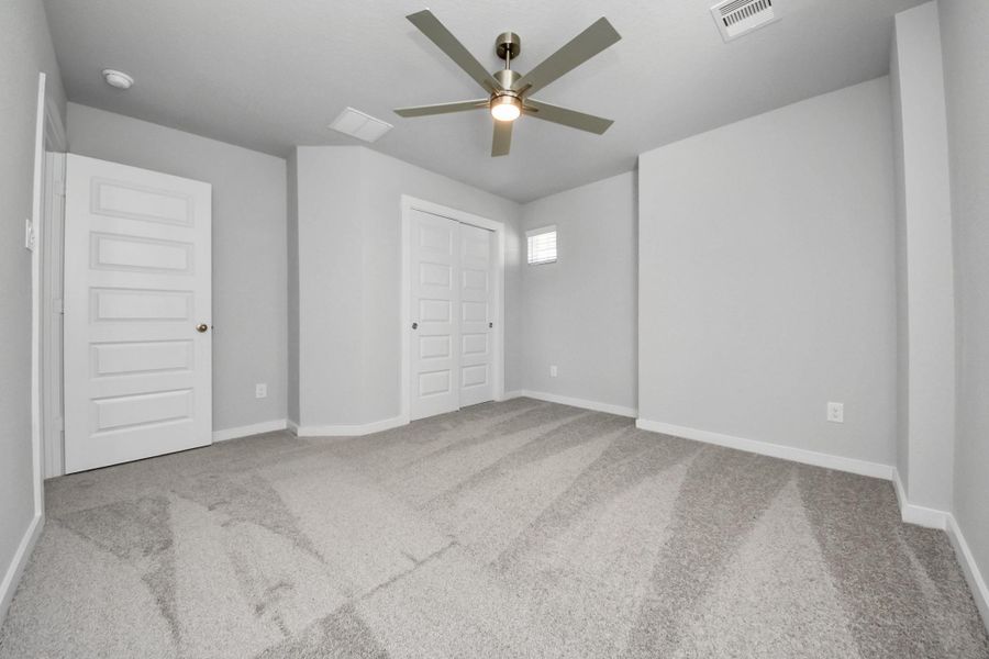 Secondary bedroom features plush carpeting, large windows that let in plenty of natural light, bright paint, and spacious closets. Secondary bedroom features plush carpeting, large windows that let in plenty of natural light, bright paint, and spacious closets.