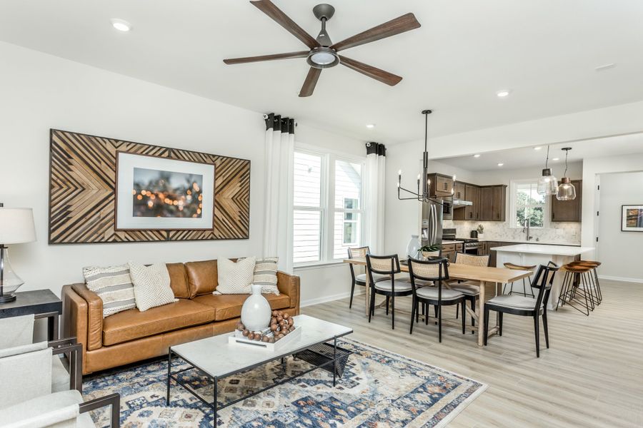 Spacious gathering room with view of kitchen