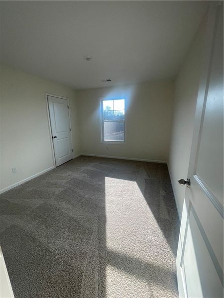 Spacious, unfurnished interior of a new home in Springwood Grove, Central (Image 37).