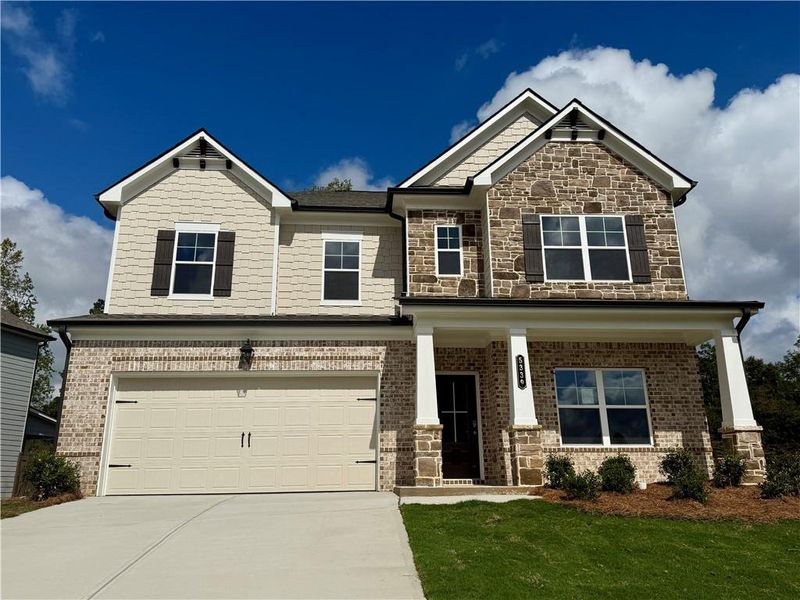 Front exterior of a new home in Ponderosa Farms Estates, Gainesville, GA, highlighting curb appeal (Image 1). Front exterior of a new home in Ponderosa Farms Estates, Gainesville, GA, highlighting curb appeal (Image 1).