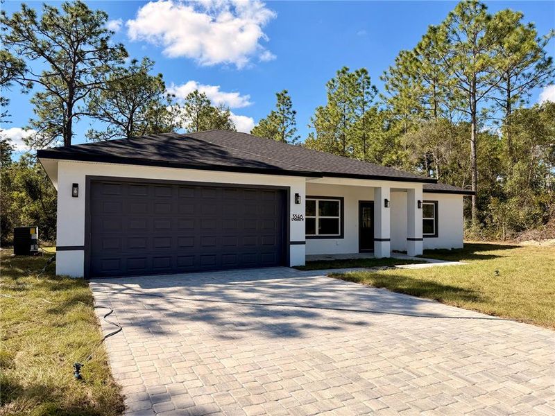 Front exterior of a new home in , Citrus Springs, FL, highlighting curb appeal (Image 1). Front exterior of a new home in , Citrus Springs, FL, highlighting curb appeal (Image 1).