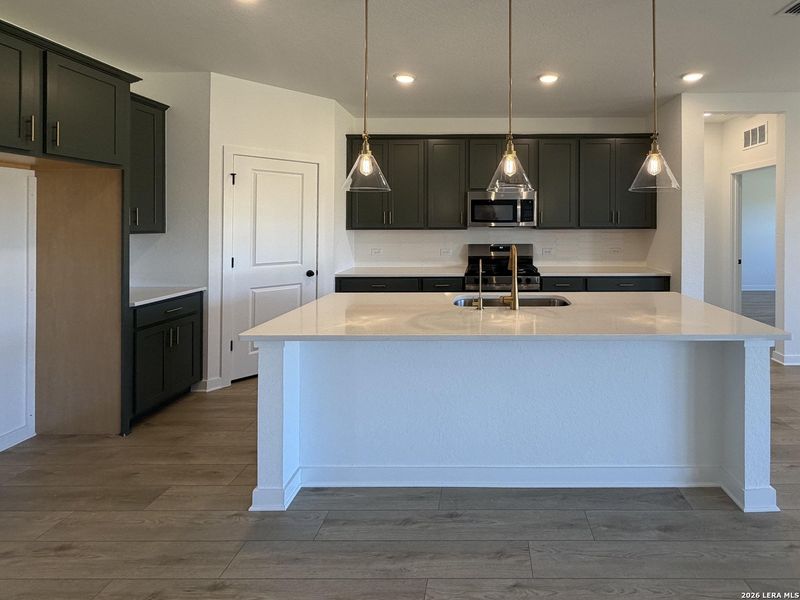 Furnished interior view inside a new home in Nopal Valley, San Antonio (Image 12).