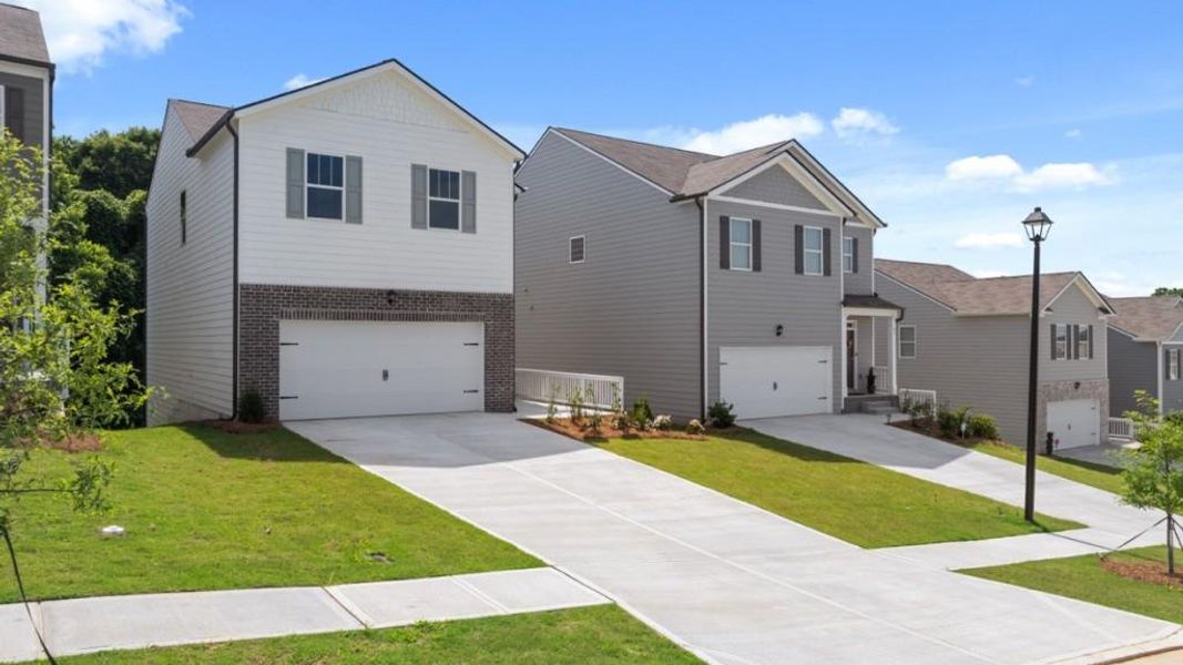 Front exterior of a new home in Rolling Meadows, Jasper, GA, highlighting curb appeal (Image 2). Front exterior of a new home in Rolling Meadows, Jasper, GA, highlighting curb appeal (Image 2).