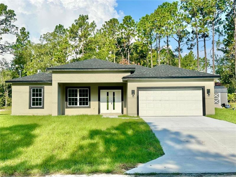 Front exterior of a new home in , Citrus Springs, FL, highlighting curb appeal (Image 17).