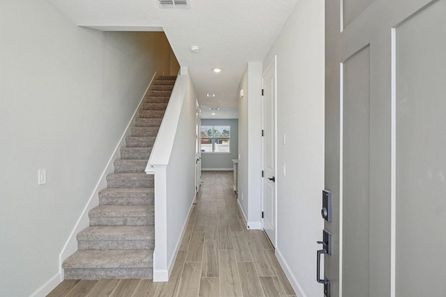 Front entry opens up into bright and airy foyer