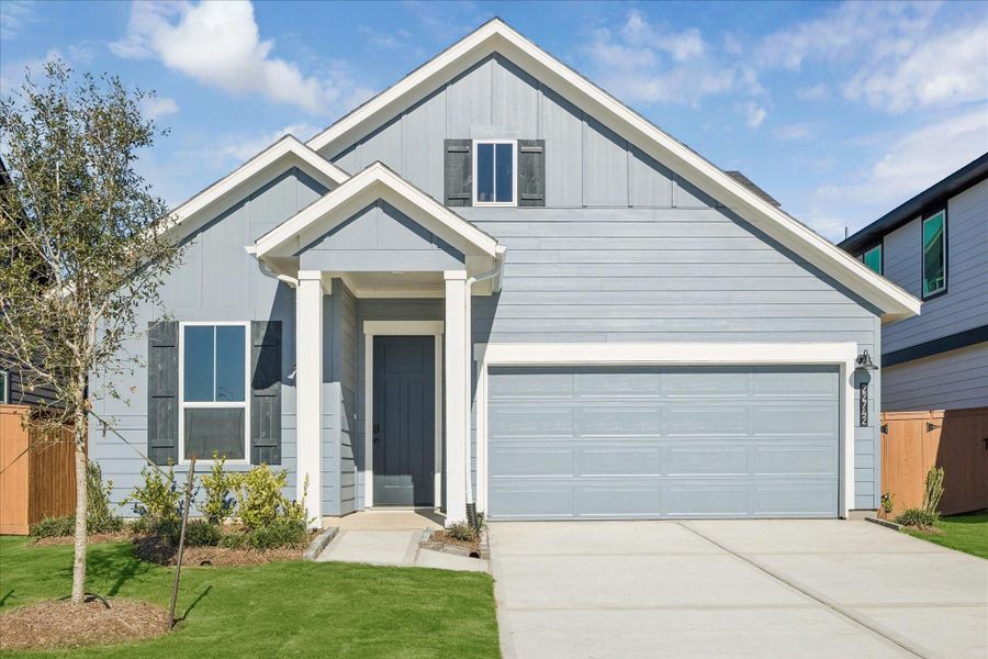 Front exterior of a new home in Elyson, Katy, TX, highlighting curb appeal (Image 2).