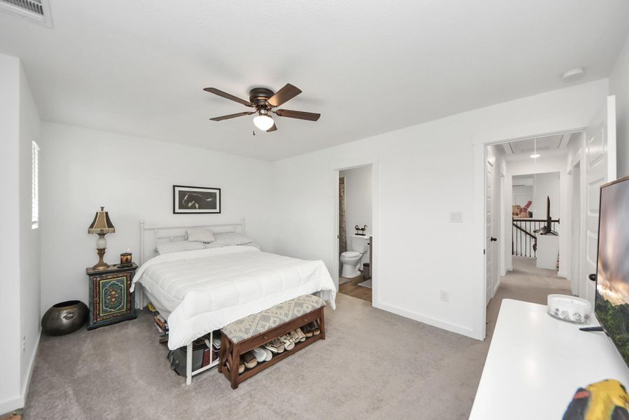 Spacious secondary suite offering a private full bath for added convenience.