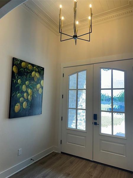 Arched double entry doors with decorative glass panels