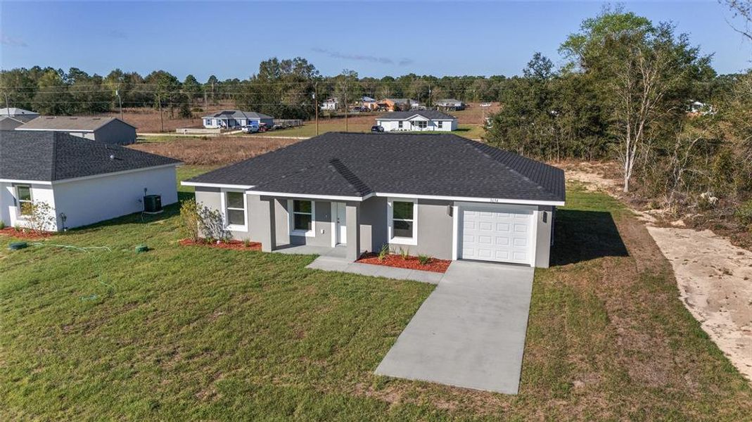 Front exterior of a new home in , Dunnellon, FL, highlighting curb appeal (Image 25).